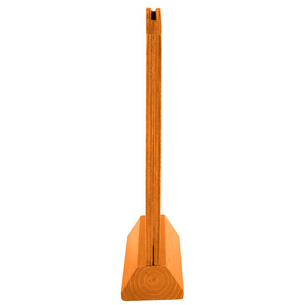 A wooden Menu Solutions Mandarin framed wood table tent with an angled base.