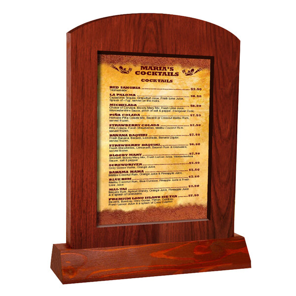 A Menu Solutions mahogany arched wood menu tent with a menu on a wooden stand.