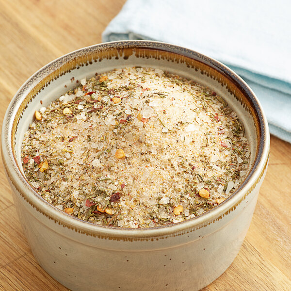 A bowl of Regal Upper Bay Crab Mix seasoning.