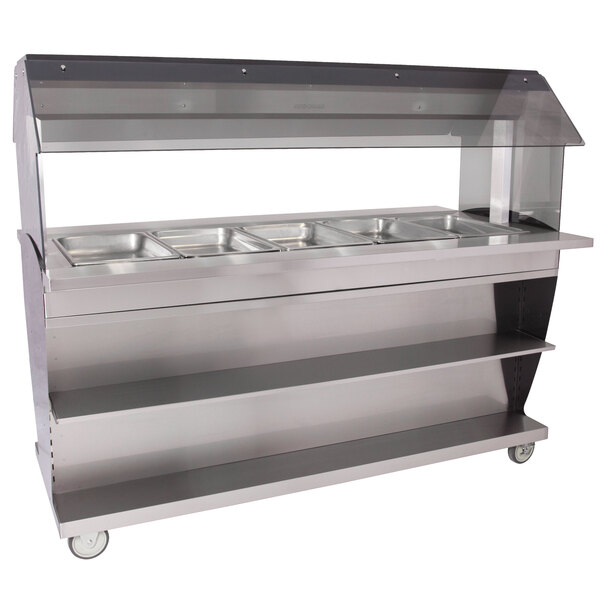 An Alto-Shaam mobile electric hot food buffet table with clear covers over food pans.