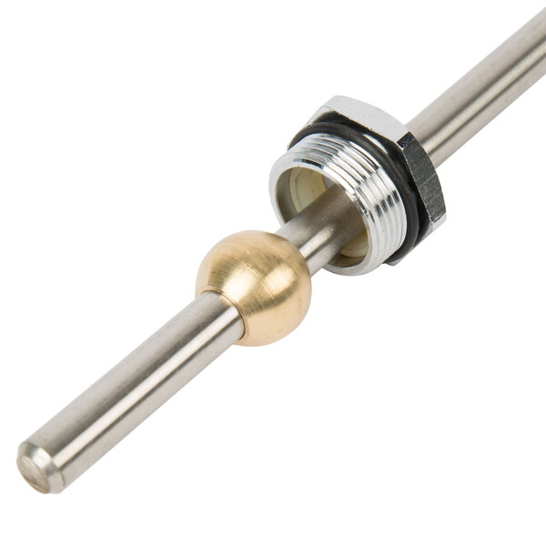 A gold plated metal rod with a metal ball on the end.