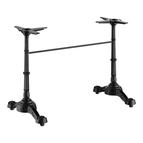 A black self-stabilizing cast iron table base with two legs and a connecting bar.
