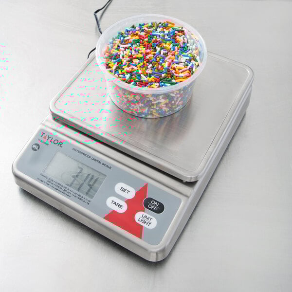 A bowl of sprinkles on a Taylor digital portion scale.