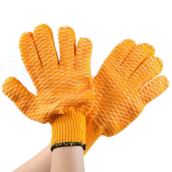 A pair of Cordova orange gloves with criss-cross PVC coating on the grip.