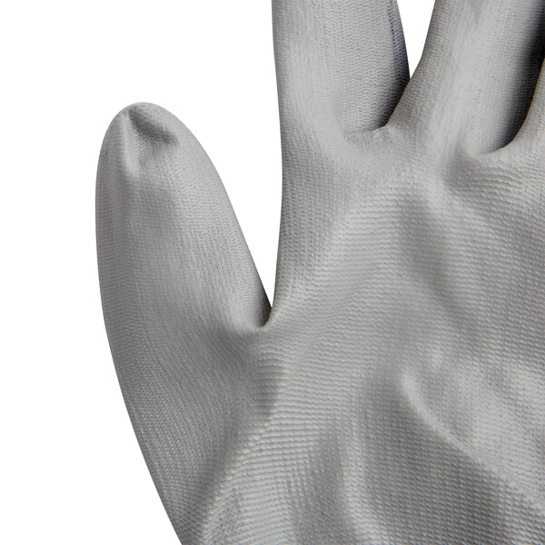 A close up of a pair of Cordova gray polyester gloves with gray polyurethane palms.
