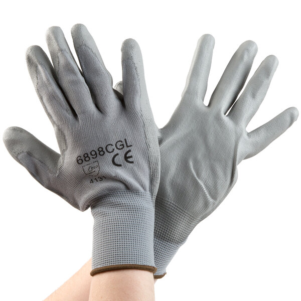 A pair of Cordova gray polyester gloves with gray polyurethane palms.