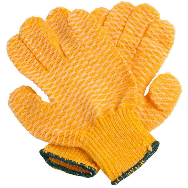 A pair of yellow Cordova warehouse gloves with green trim and criss-cross PVC coating.