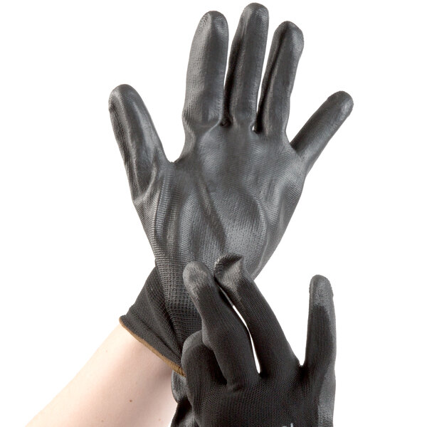 A pair of black Cordova polyester gloves with black polyurethane palms.