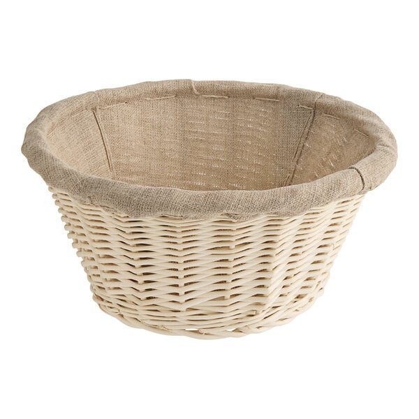 A Matfer Bourgeat round wicker banneton with a linen lining.
