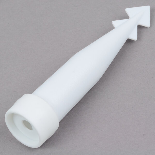 A close-up of a white plastic Wilton floral cake spike with a pointed tip.