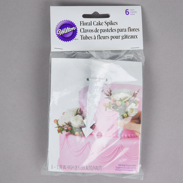 A package of Wilton floral cake spikes.