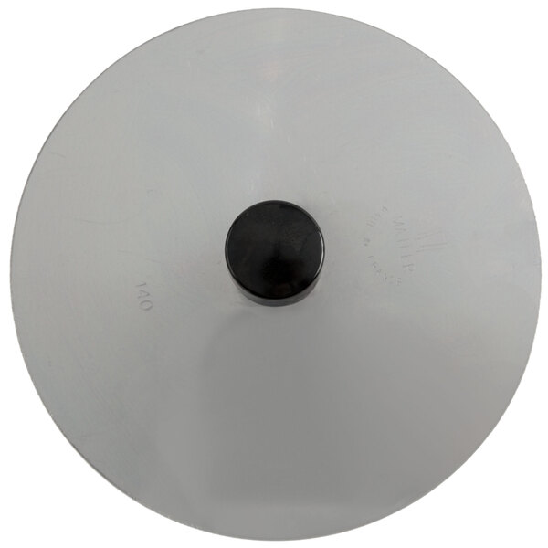 A circular stainless steel tool with a black handle.