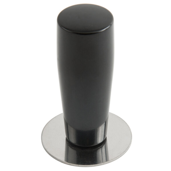 A black and silver metal Matfer Bourgeat pack down tool with a black Bakelite handle.