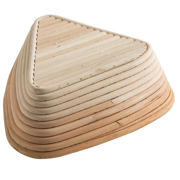 A wooden triangle shaped Matfer Bourgeat Banneton Proofing Basket.