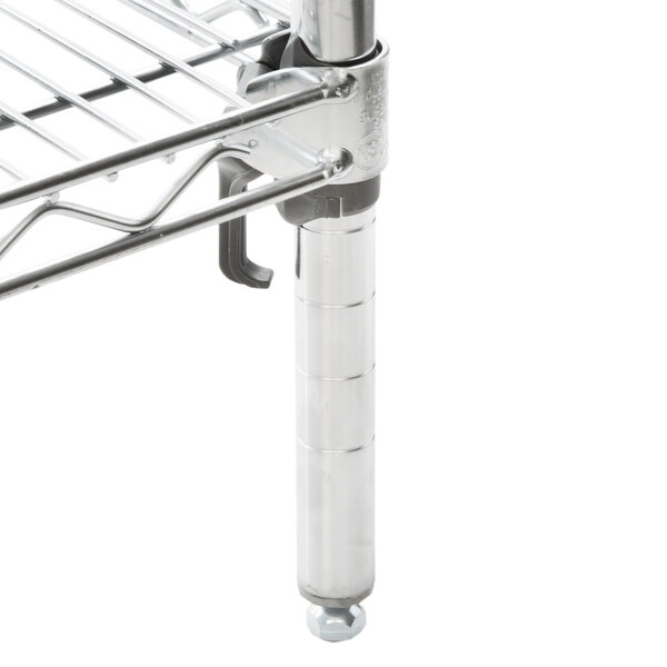 A Metro chrome wire shelving unit with four metal shelves and two metal legs.