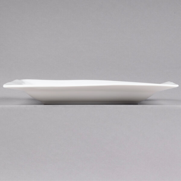 A CAC white rectangular porcelain plate.