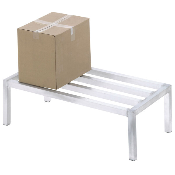 A cardboard box on a Channel aluminum dunnage rack.
