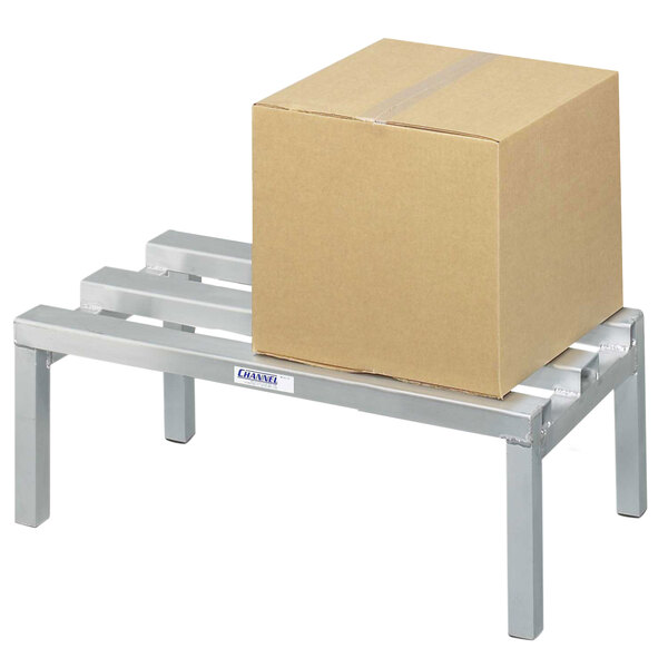 A Channel aluminum dunnage rack with a box on it.
