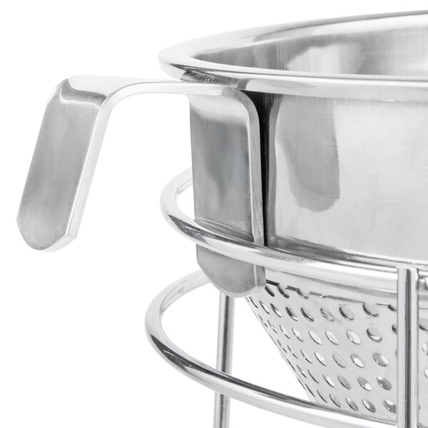 A Weston stainless steel China cap strainer with a metal handle.