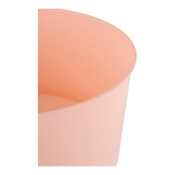 A round, rose-colored plastic base for a beverage dispenser.