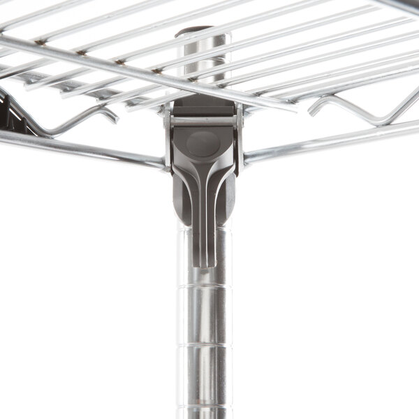 A Metro chrome wire shelving unit with metal shelves and rods.