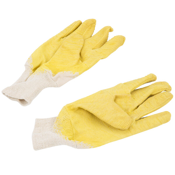 A pair of Cordova Ruffian yellow crinkle latex gloves with canvas lining over white gloves.