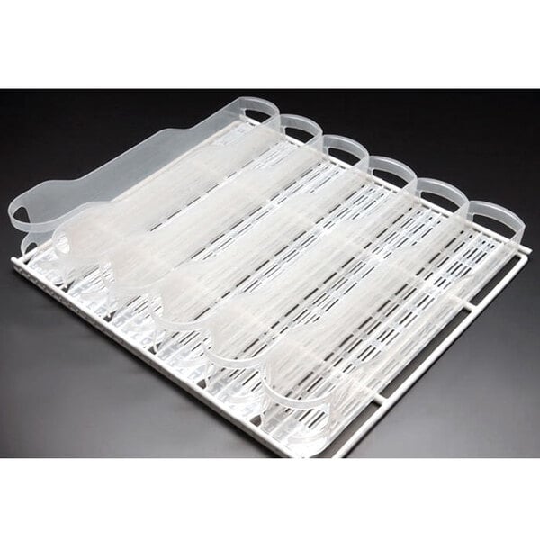 A white plastic Trueflex bottle organizer tray with plastic tubes.