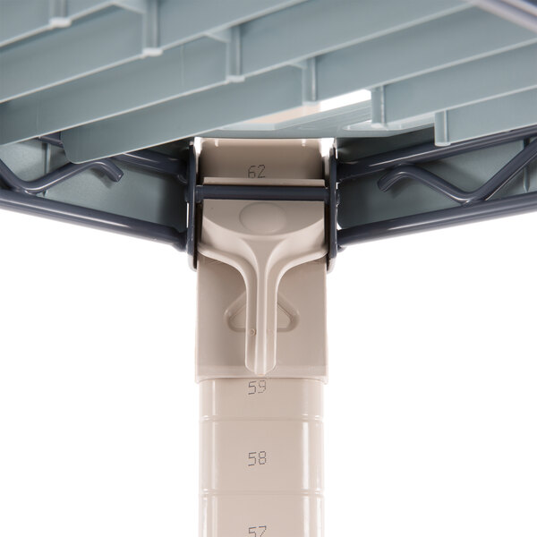 A close up of a metal pole with a screw.