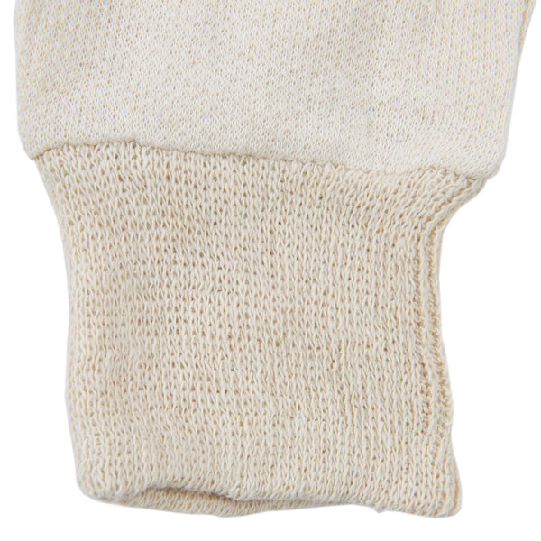 A close up of a pair of white knitted Cordova jersey gloves.