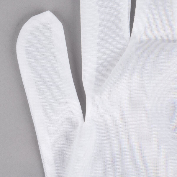 A pair of Cordova Men's Nylon Reversible Inspector's gloves on a gray surface.