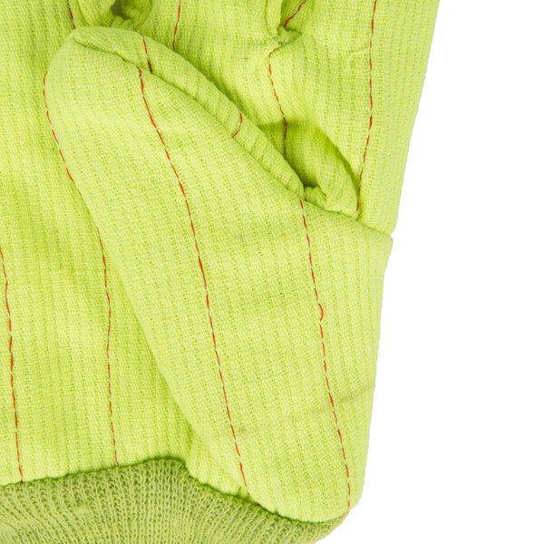 A close up of a hi-vis yellow Cordova work glove with red stitching on the palm.