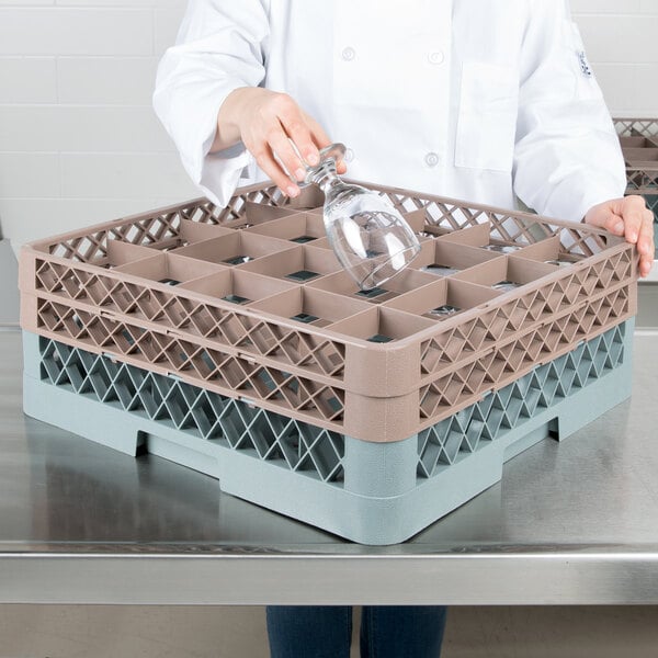 A woman using a Noble Products glass rack to hold a wine glass.