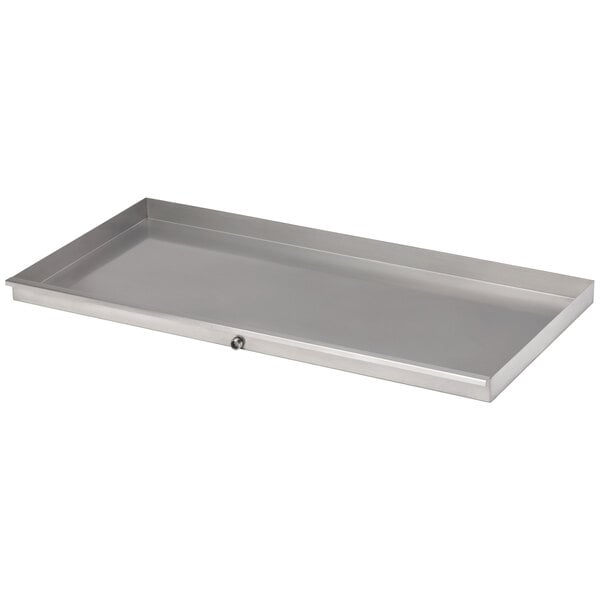 A silver rectangular metal tray with a hole in it.