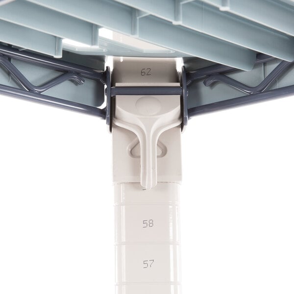 A close up of a metal pole with a white handle from a MetroMax Q shelving unit.