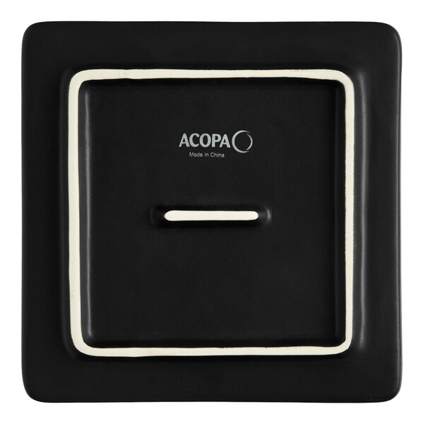 A square matte black stoneware flat plate with a minimalist design.