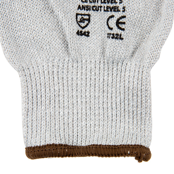 A close up of a Cordova Commander white cut resistant glove with black foam nitrile coating.