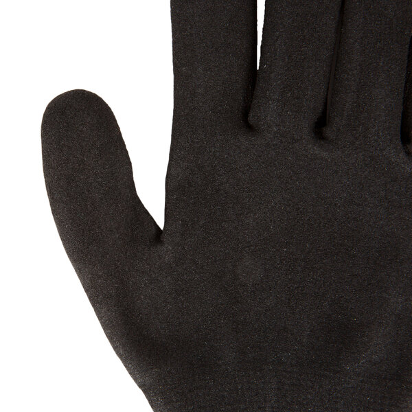 A close-up of a medium Cordova Sapphire Blue warehouse glove with black sandy nitrile coating.