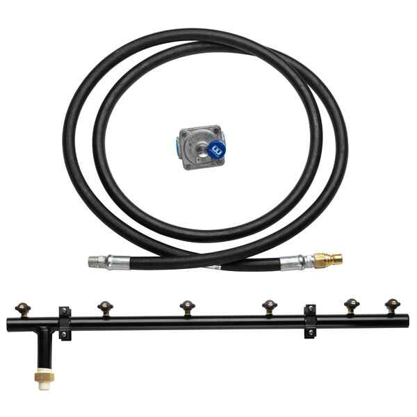 A black hose and metal tube in a Crown Verity natural gas conversion kit.