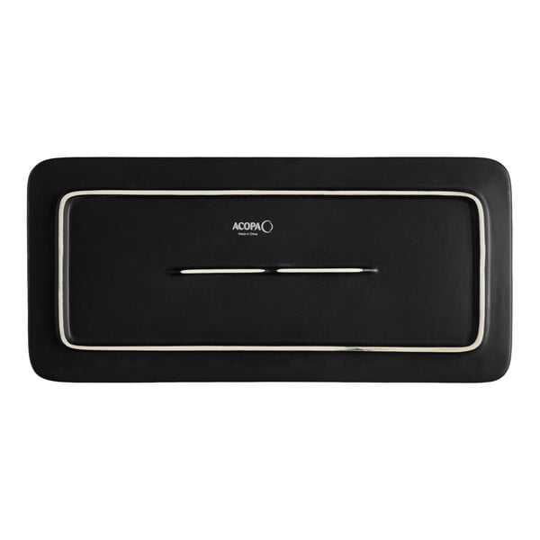 A rectangular matte black stoneware flat plate with a subtle border design.
