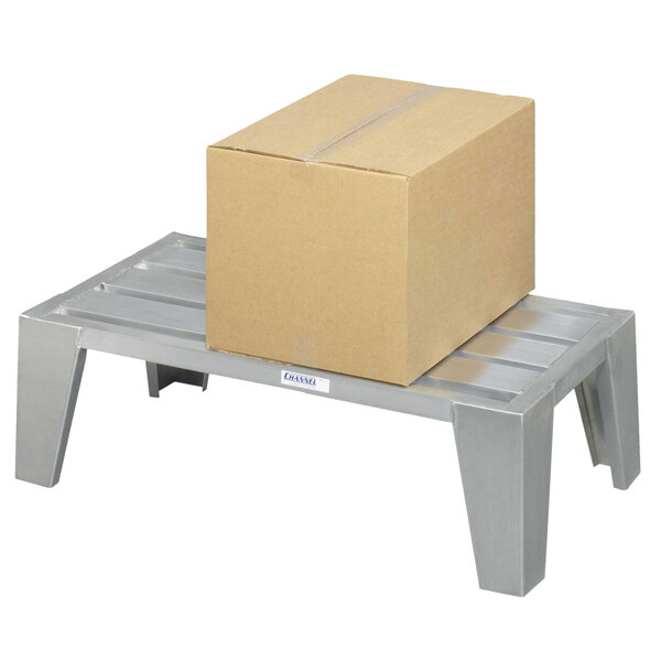 A Channel heavy-duty aluminum dunnage rack with a box on it.