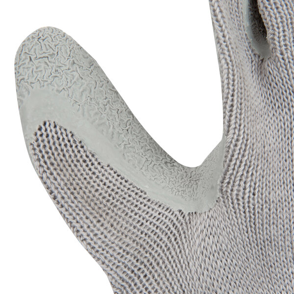 A close up of a Cordova gray and white glove with a crinkle latex palm coating.