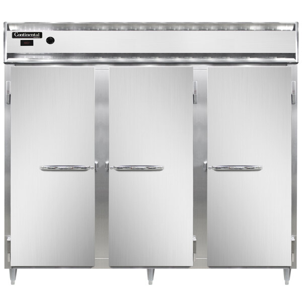 A white rectangular Continental holding cabinet with a black border and three open stainless steel doors.