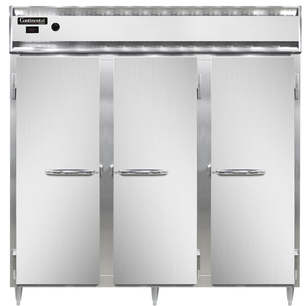 A row of white Continental heated holding cabinet doors with handles open.