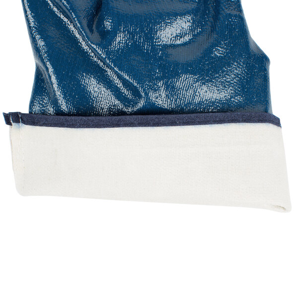 A blue and white Cordova warehouse glove with a white lining.