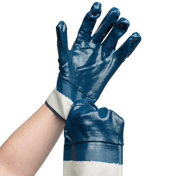 A hand wearing blue and white Cordova warehouse gloves.