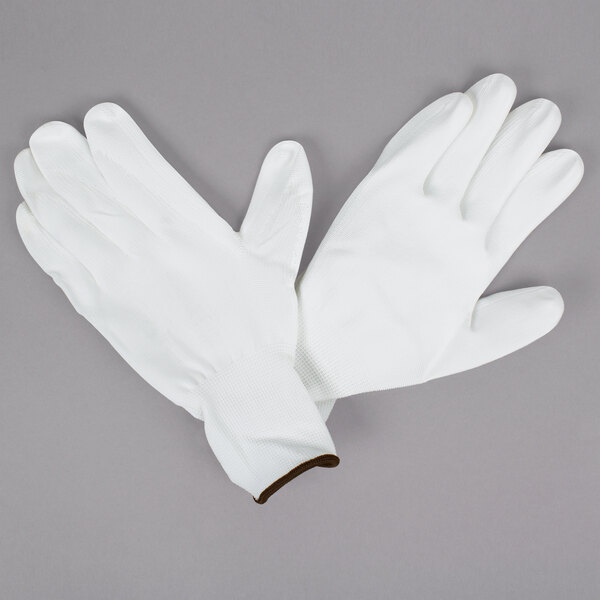 A pair of Cordova white nylon gloves with white polyurethane palm coating.