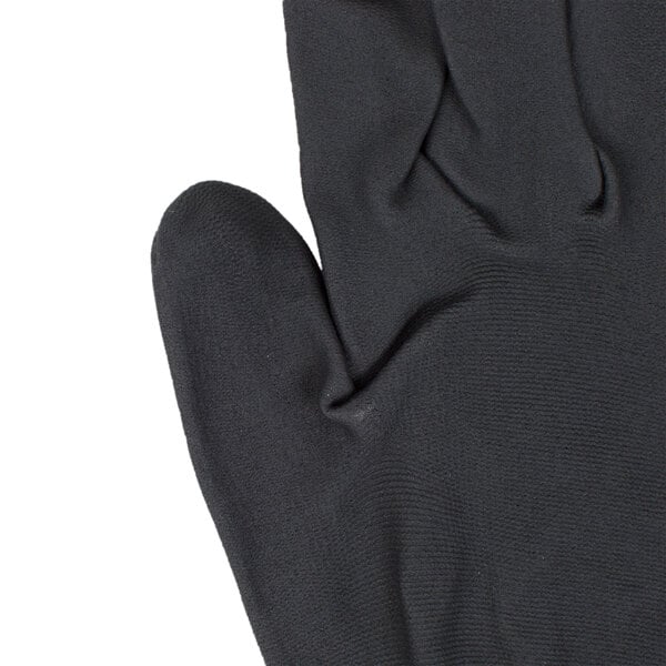 A close-up of a black Cordova Cor-Touch foam plus glove with a black foam palm coating.