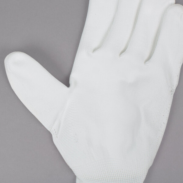 A white Cordova warehouse glove with white polyurethane coating on the palm.