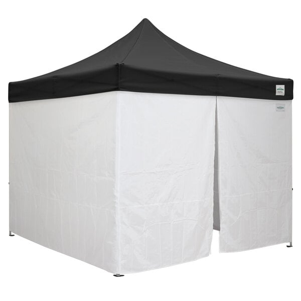 A black Caravan Canopy with a white top.