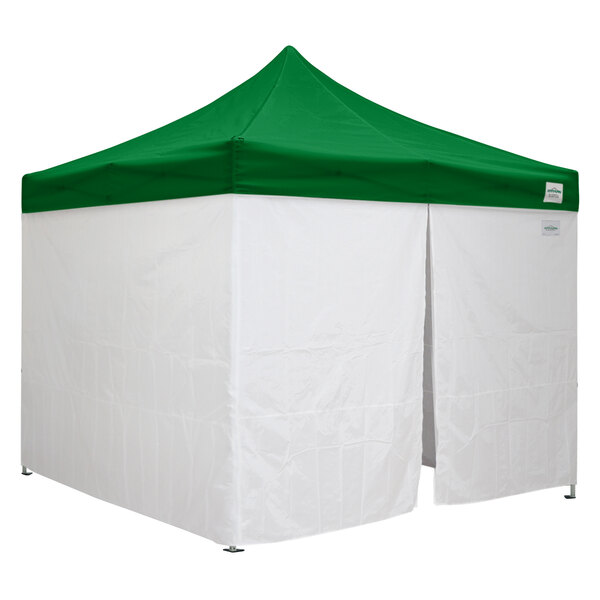 A white tent with a green top.